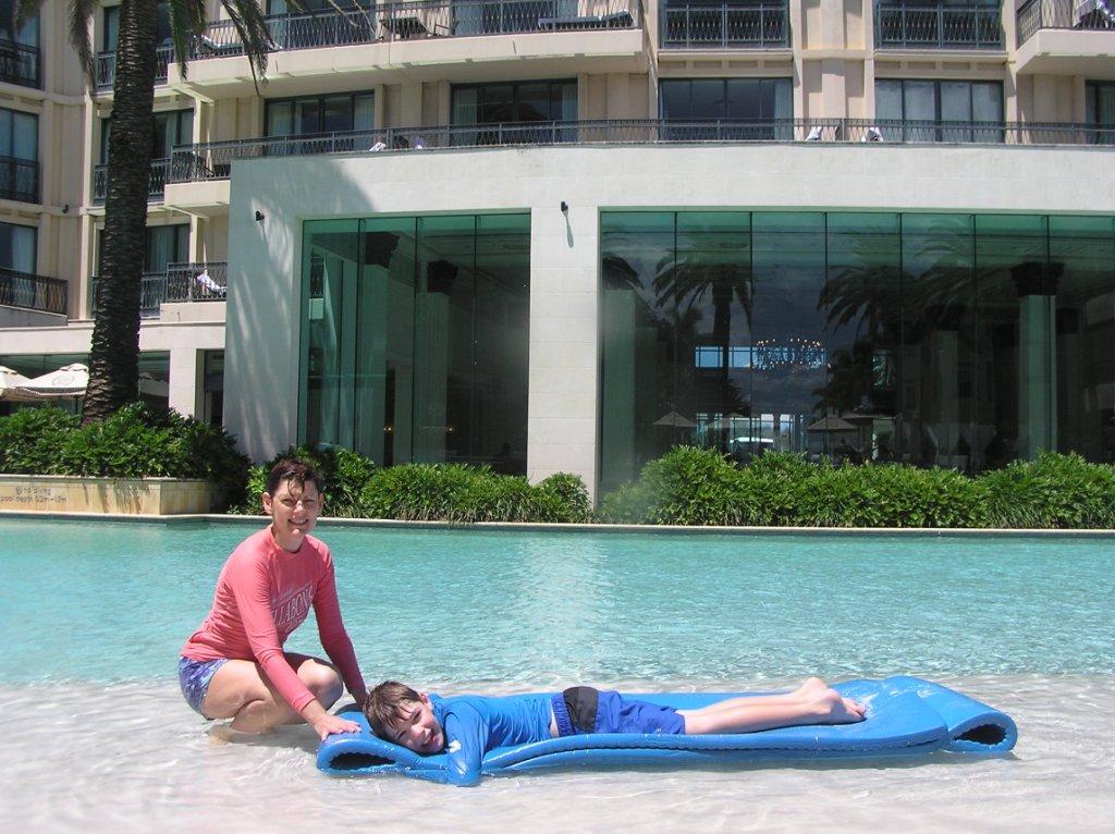 Amanda and Bradley relaxing by the pool ’beach’ within Palazzo Versace © Stephen Milne